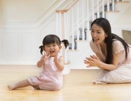 A mother playing with her toddler.